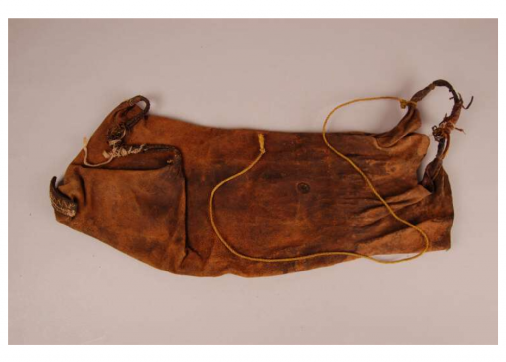 Brown animal skin bag on white backdrop used for time tested fermentation