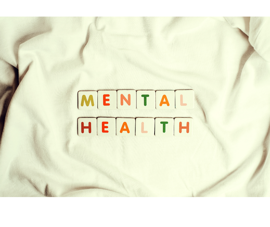 White square tiles set on white sheet with colored letters spelling "mental health."