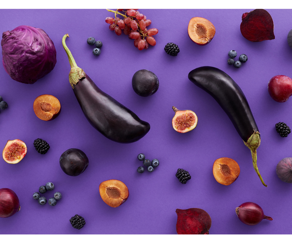 Purple vegetables and fruit with betalain arranged on a purple background